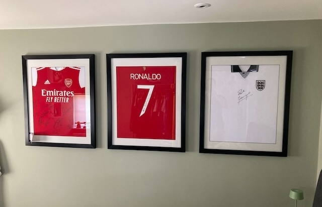 Expert wall mounting of framed football shirts in Welwyn Garden City